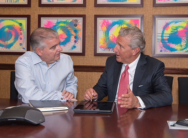 Richard Butwin and client at a table