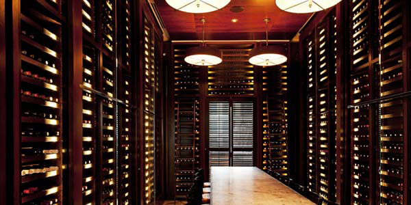 Photo of elegant, well-stocked wine cellar